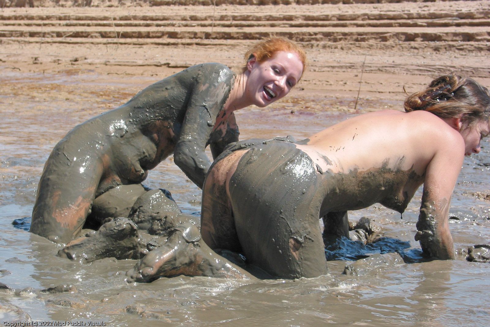 Nude Girls In The Mud